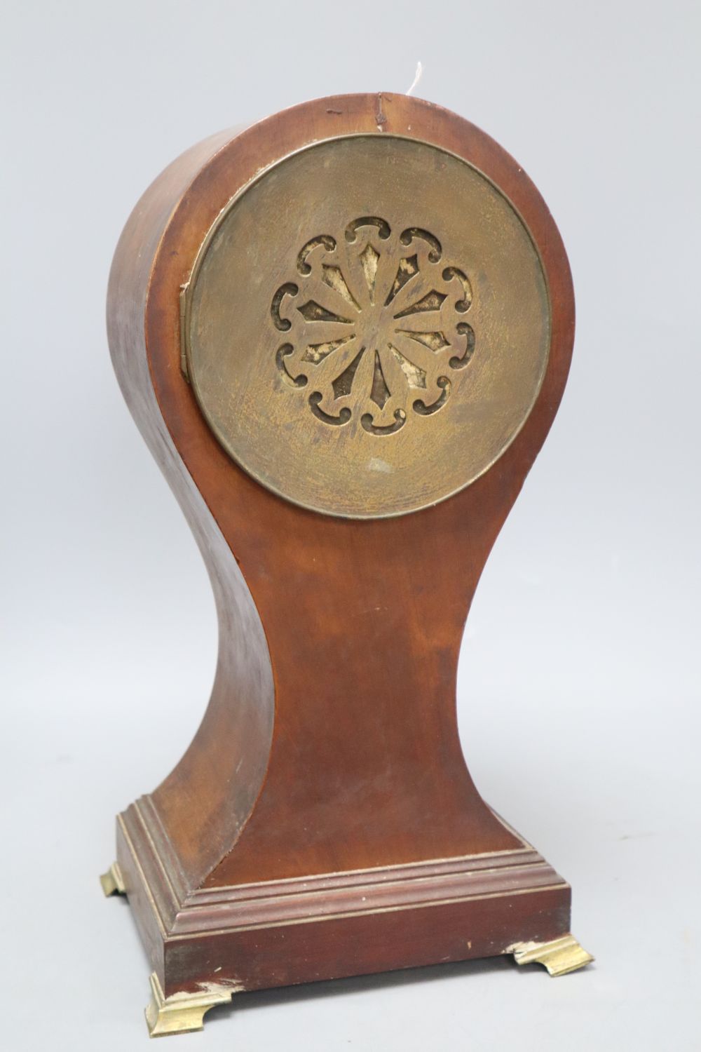 A mahogany balloon cased clock, with French movement, height 40cm